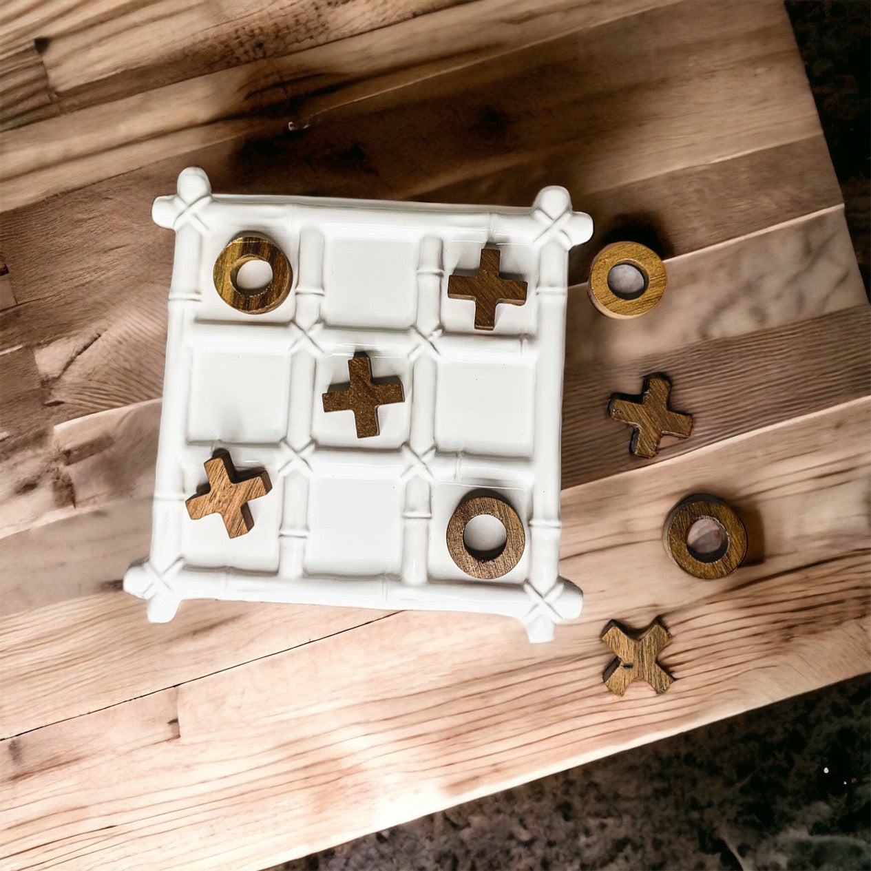 Faux Bamboo Tic Tac Toe game featuring a ceramic board and acacia wood pieces, elegantly designed for decor and play.