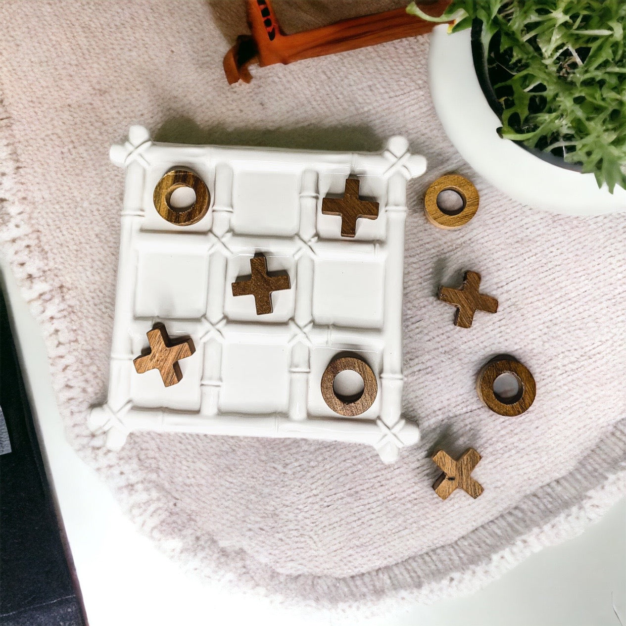 Faux Bamboo Tic Tac Toe game featuring a ceramic board and acacia wood pieces, elegantly designed for decor and play.