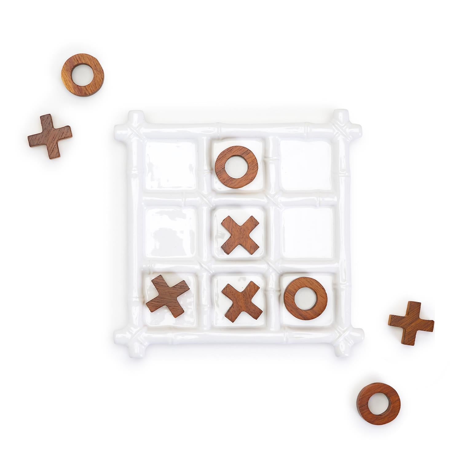 Faux Bamboo Tic Tac Toe game featuring a ceramic board and acacia wood pieces, elegantly designed for decor and play.