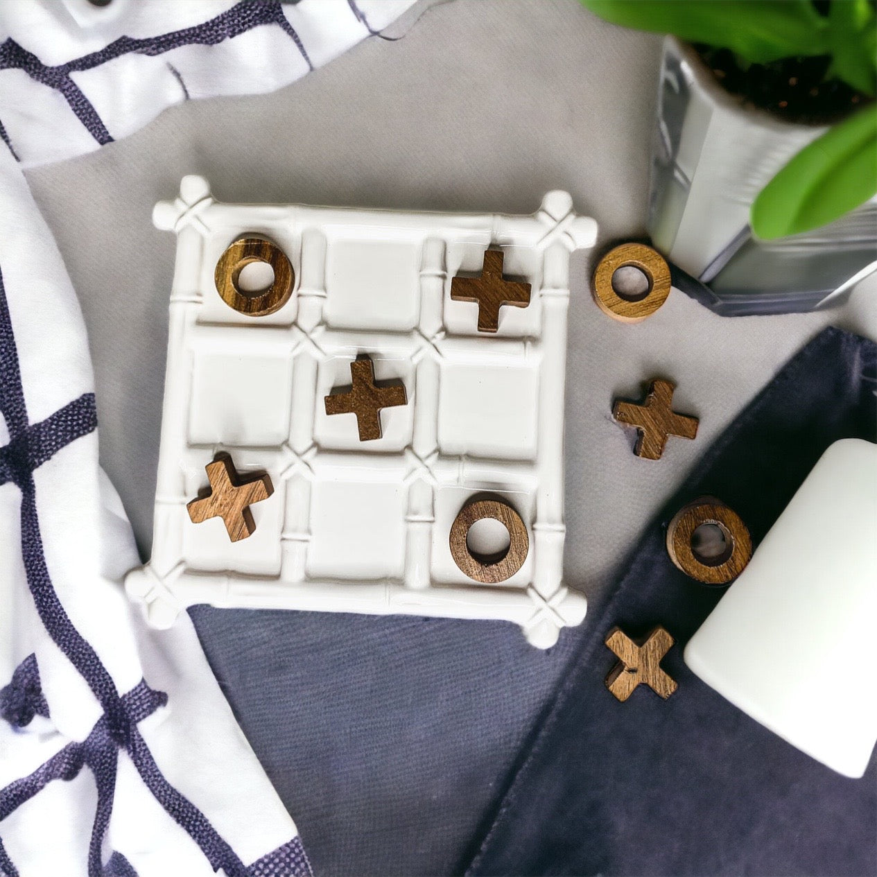 Faux Bamboo Tic Tac Toe game featuring a ceramic board and acacia wood pieces, elegantly designed for decor and play.