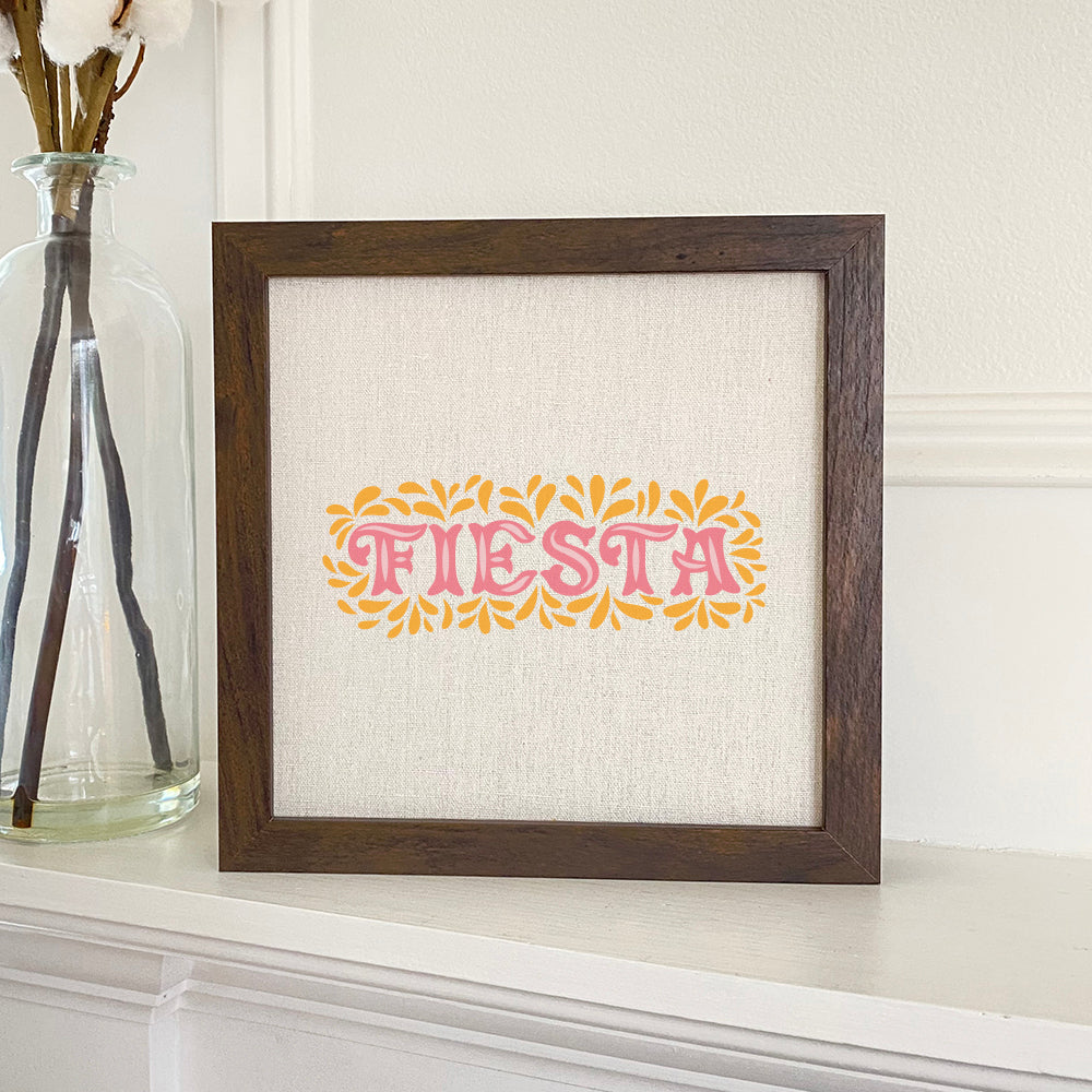 Fiesta Framed Sign with a stylized wood frame and linen-look background, perfect for shelf or wall display.