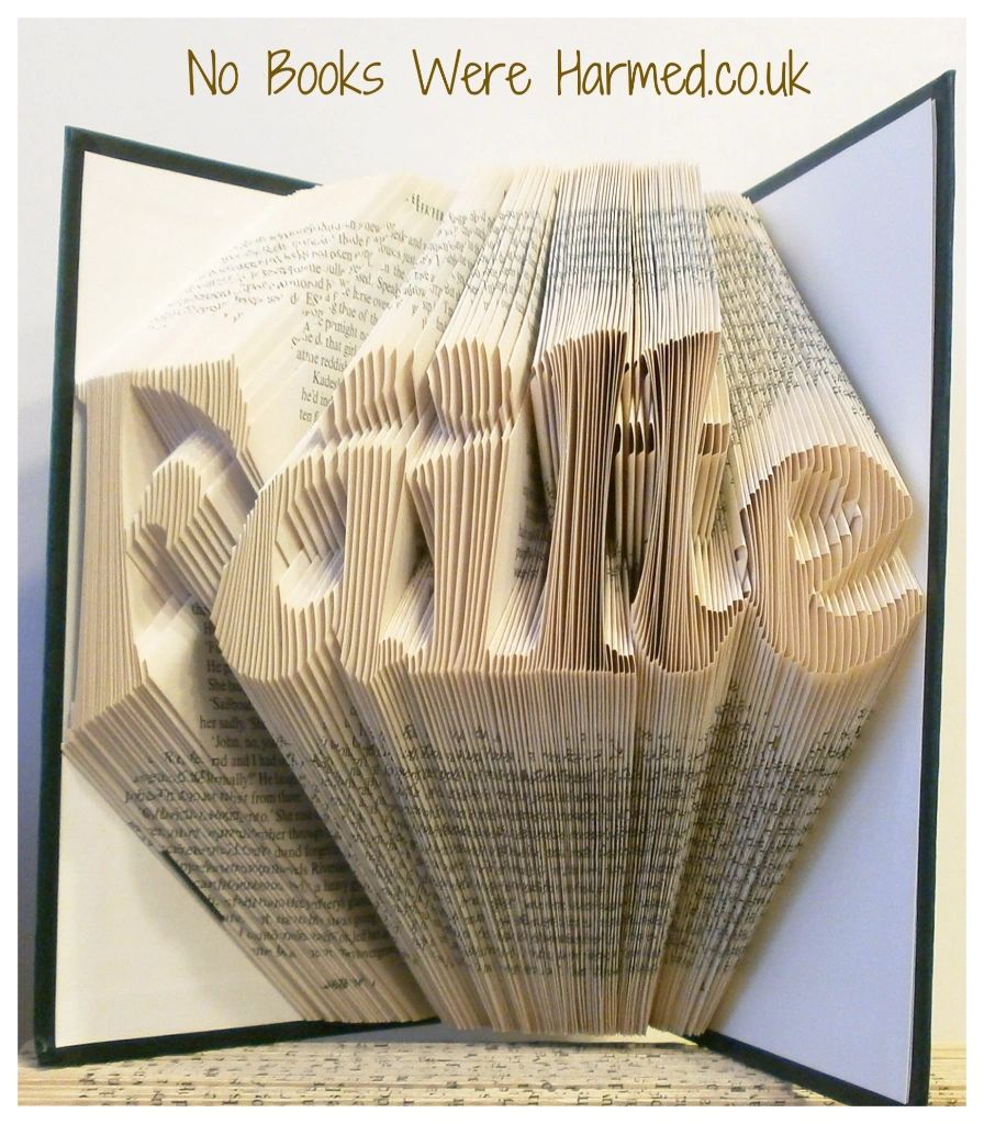 Hand-folded book art displaying the word 'Fàilte', symbolizing welcome in Scottish Irish culture, crafted from vintage books.