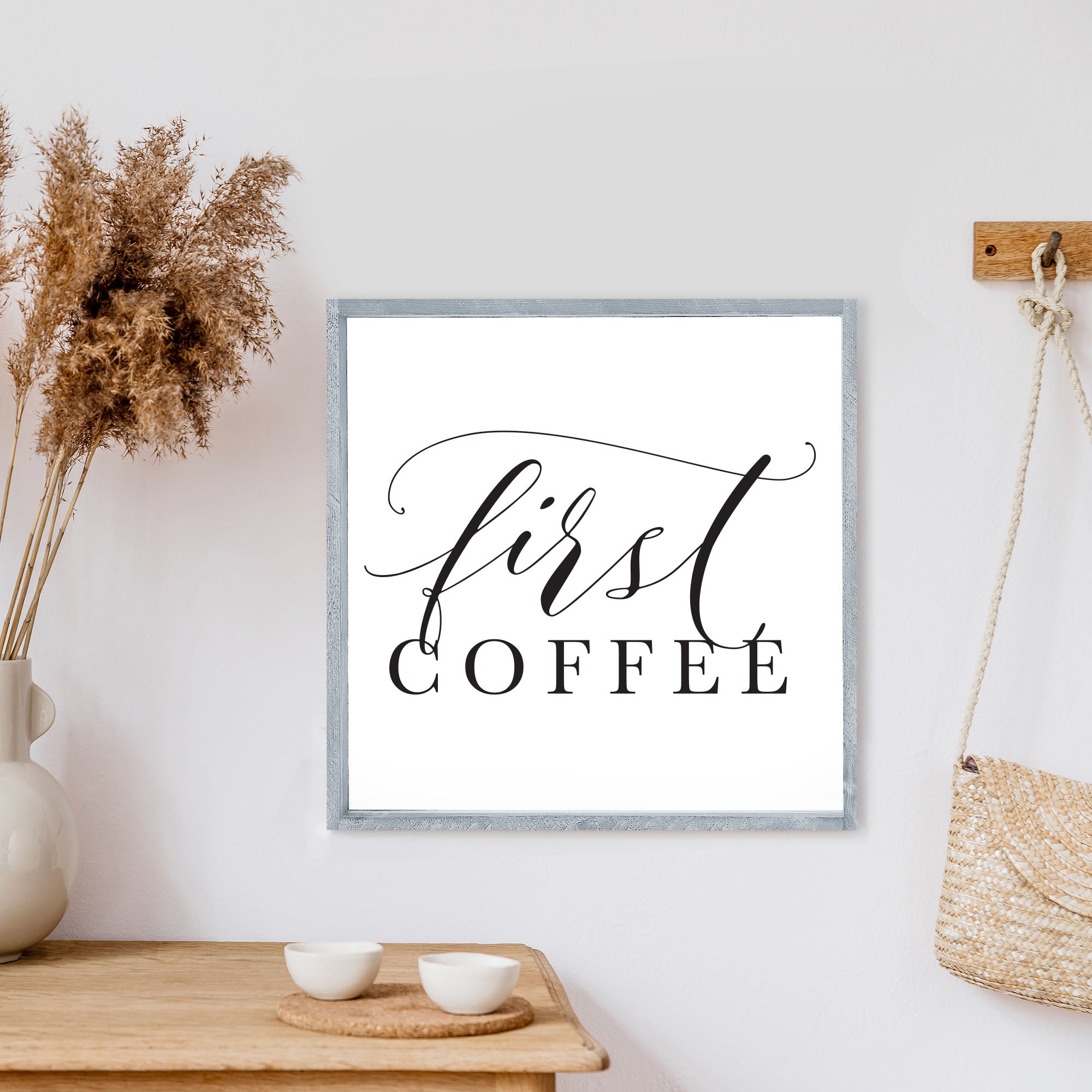 A rustic First Coffee Wood Sign measuring 13x13 inches, featuring a wood-stained pine frame and waterproof black text on a white background.