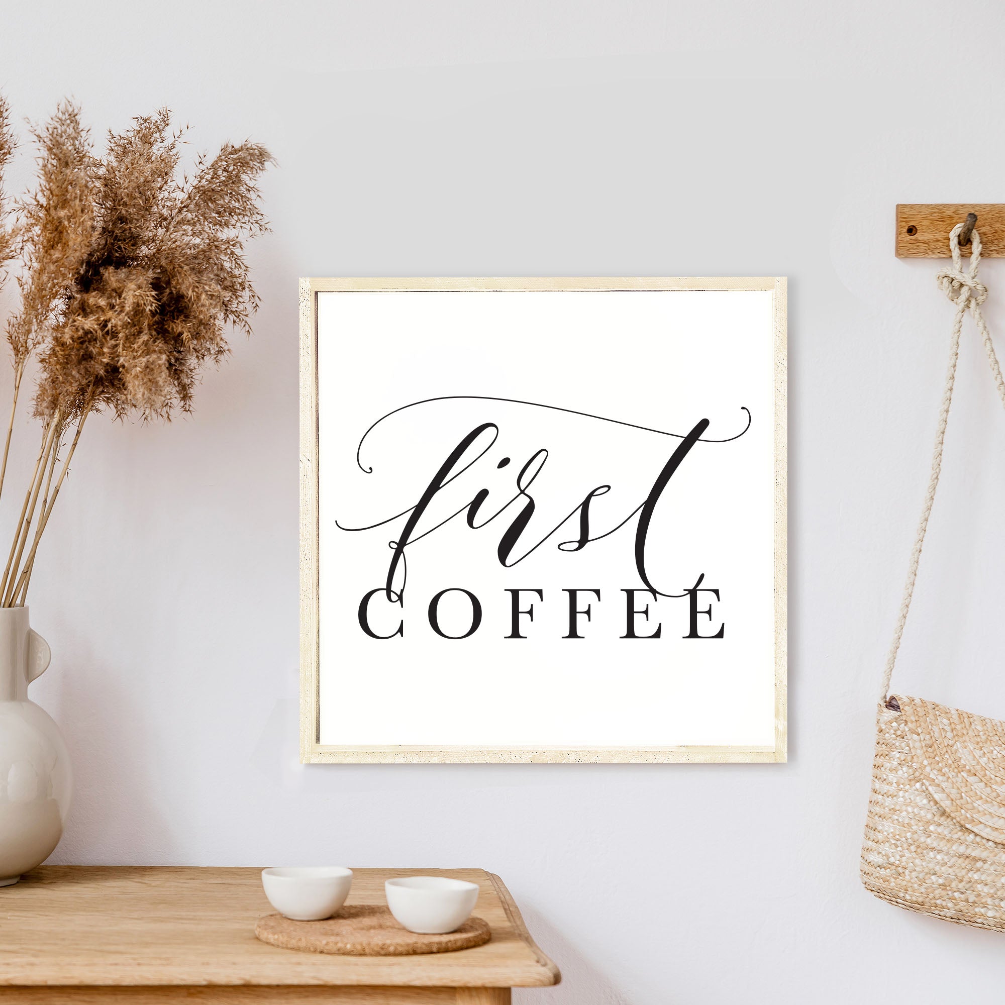 A rustic First Coffee Wood Sign measuring 13x13 inches, featuring a wood-stained pine frame and waterproof black text on a white background.