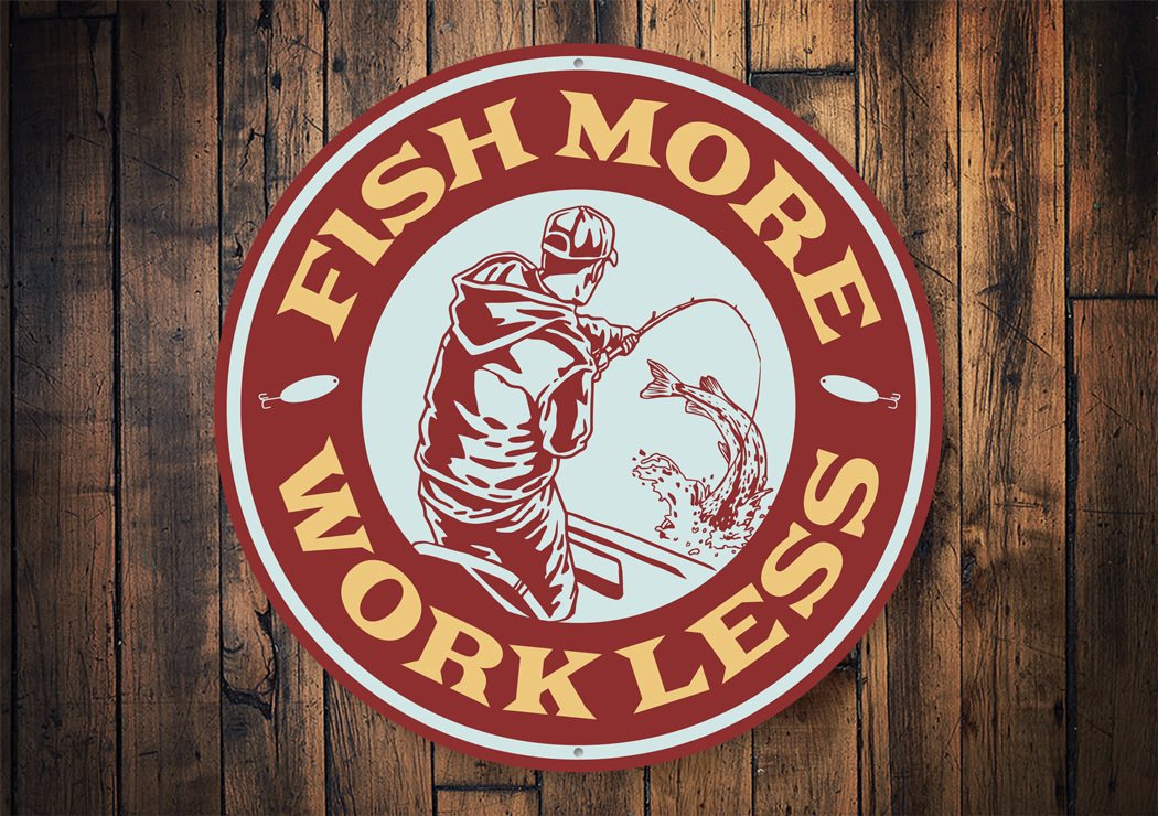 Fish More, Work Less Cabin Sign made of durable aluminum, featuring a rustic design perfect for lakehouse decor.