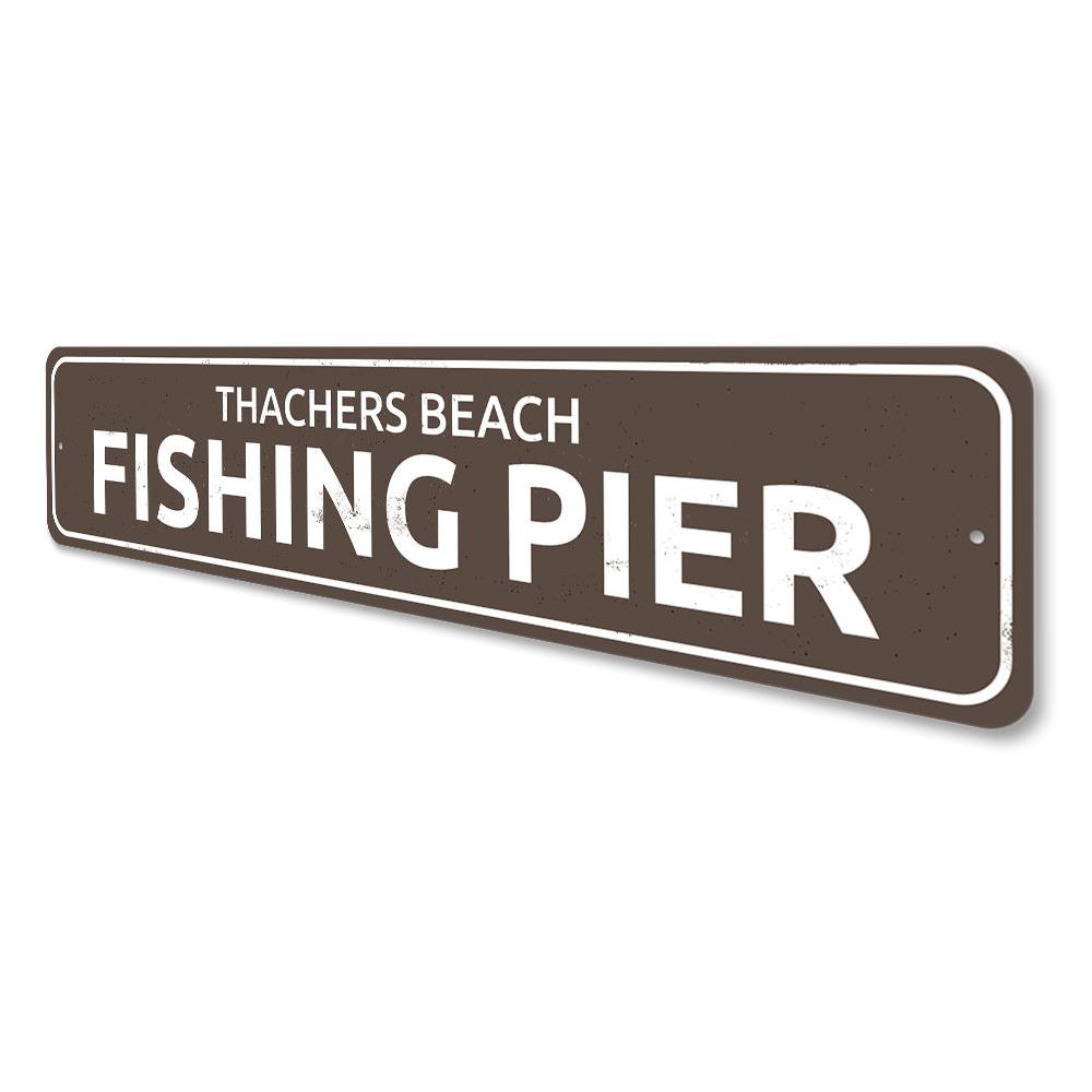 A beautifully crafted Fishing Pier Sign made of durable aluminum, featuring customizable text, perfect for lakehouse decor.