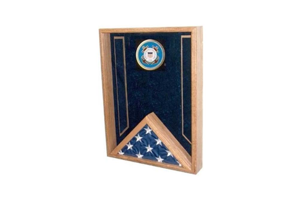 Navy Flag Display Case made of solid hardwood, featuring a triangular flag holder, medals display area, and crushed velvet background.