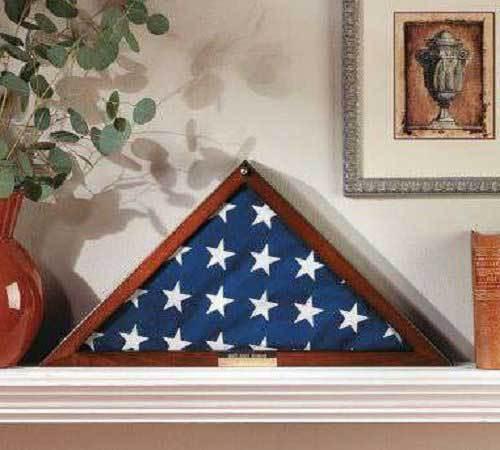 Elegant polished wood flag display case with glass front and personalized brass plaque for veterans.