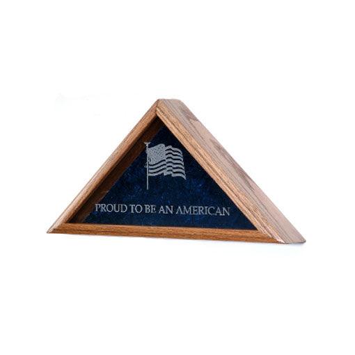 A beautifully crafted flag display case made of solid wood, showcasing a folded American flag with a crushed velvet background.