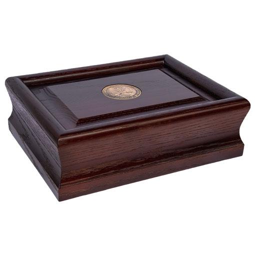 Patriot Urn made from solid American hardwoods with a serpentine edge profile, finished in Cherry, featuring a brass medallion.