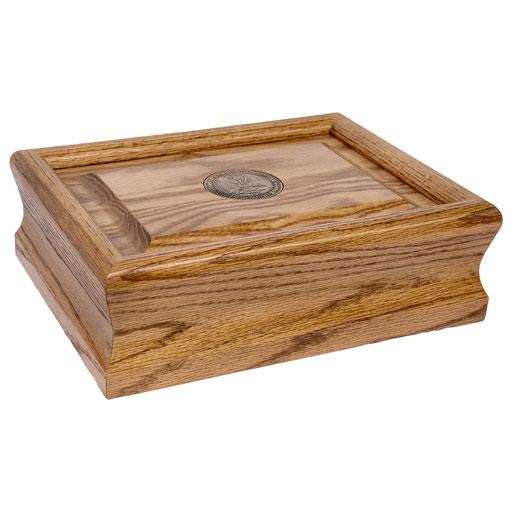 Patriot Urn made of solid oak with a brass medallion, featuring a serpentine edge profile, honoring Coast Guard veterans.