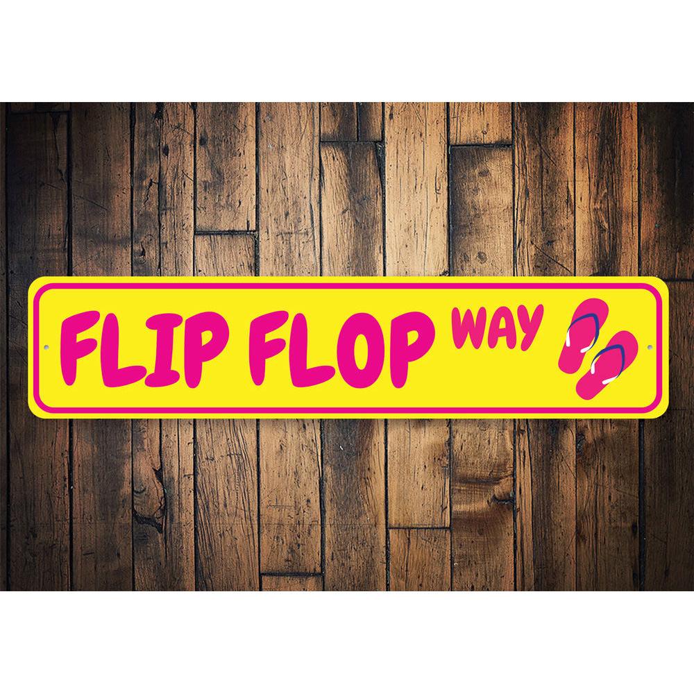 A colorful Flip Flop Way Sign made of aluminum, featuring vibrant beach-themed graphics, perfect for coastal decor.