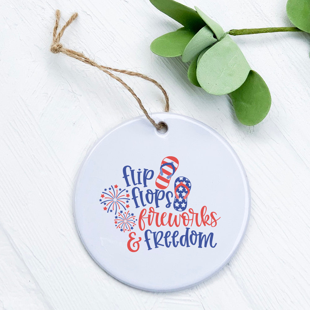 A beautifully designed porcelain ornament featuring flip flops and fireworks, symbolizing freedom and summer celebrations.