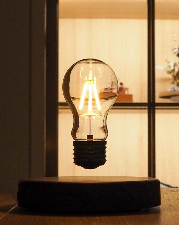 A stylish Floating Bulb Lamp showcasing a levitating bulb above a sleek base, creating a magical lighting effect.