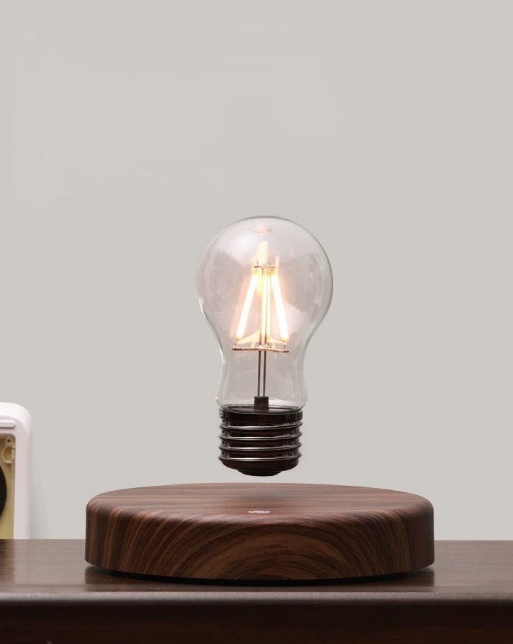 A stylish Floating Bulb Lamp showcasing a levitating bulb above a sleek base, creating a magical lighting effect.