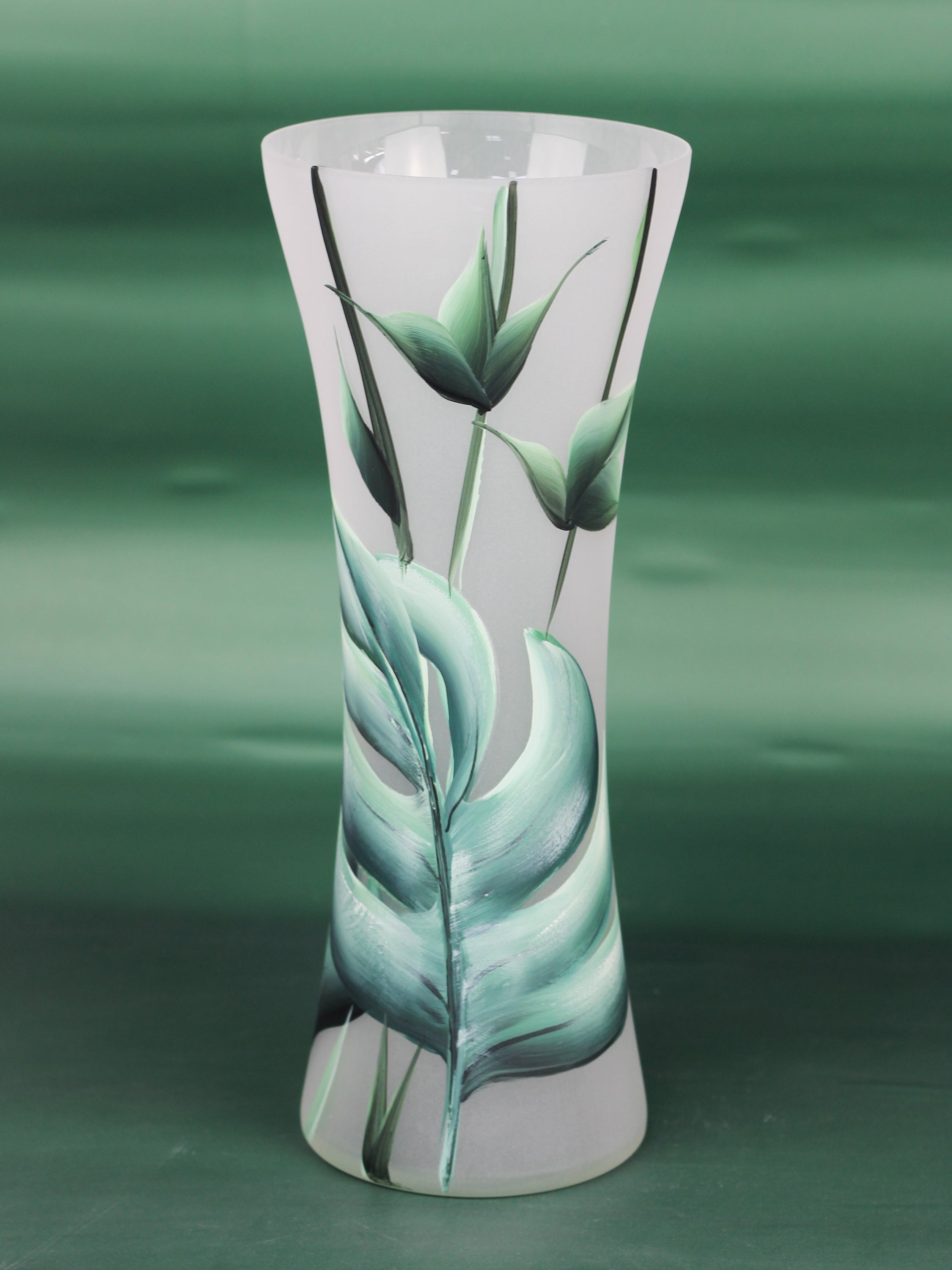 A beautifully hand-painted floor green decorative glass vase featuring intricate nature-inspired designs, showcasing vibrant colors and unique patterns.