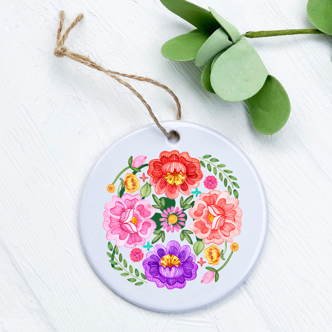 Floral Circulo ornament made of high-quality porcelain with a vibrant design, measuring 2.75 inches in diameter.