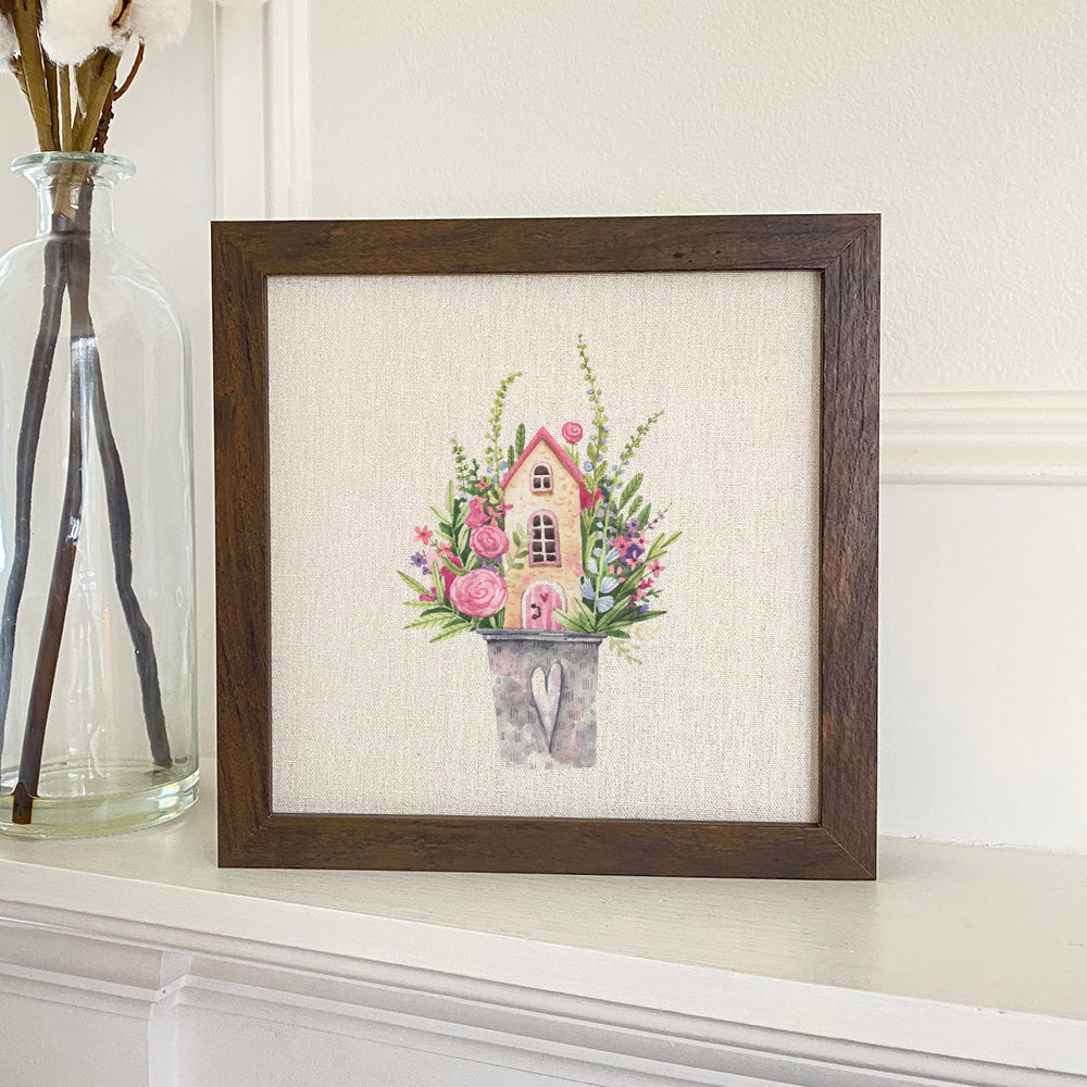 Floral Pail Fairy House framed sign with a stylized wood frame, eco-friendly printing on a linen-look background.