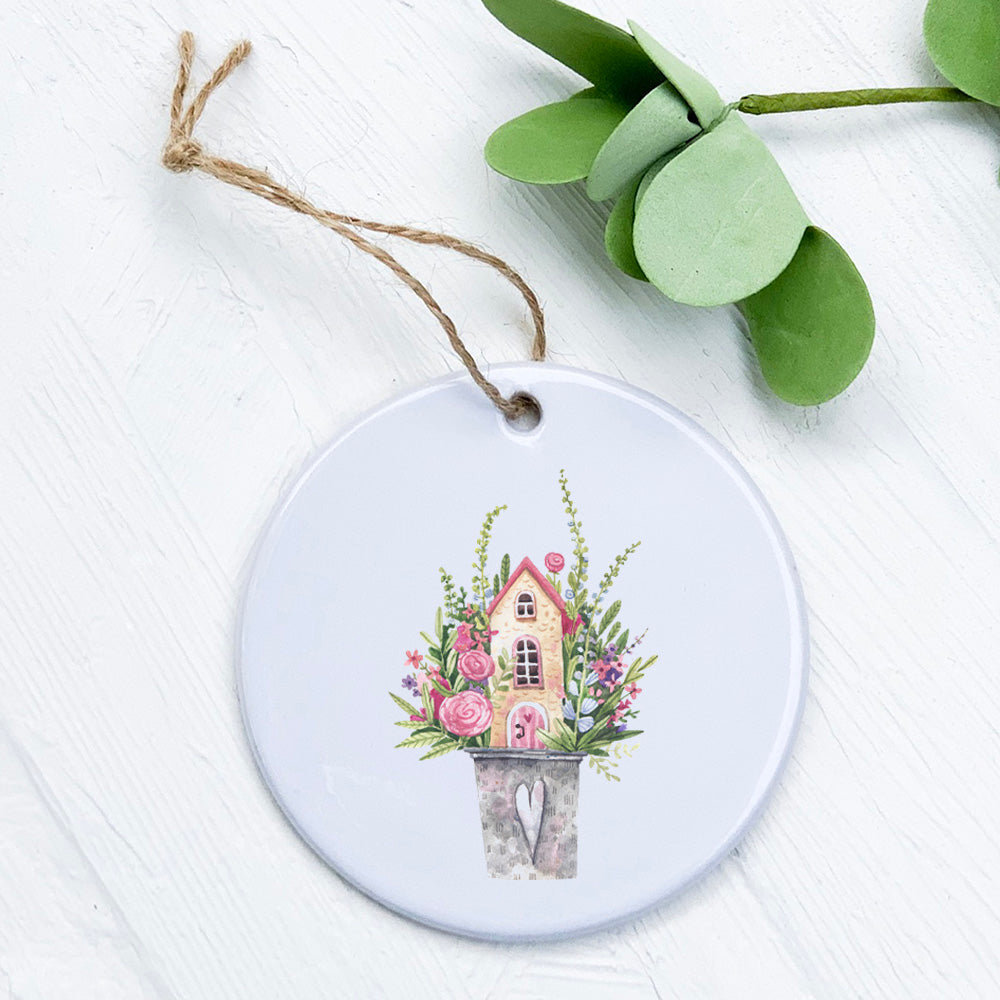 Floral Pail Fairy House ornament made of high-quality porcelain with vibrant design, perfect for home decor or gifting.