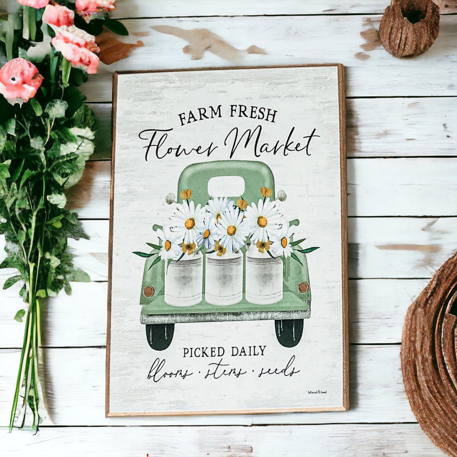 Farm Fresh Flower Market sign featuring a vintage green pickup truck filled with flowers, set against a rustic white washed background.