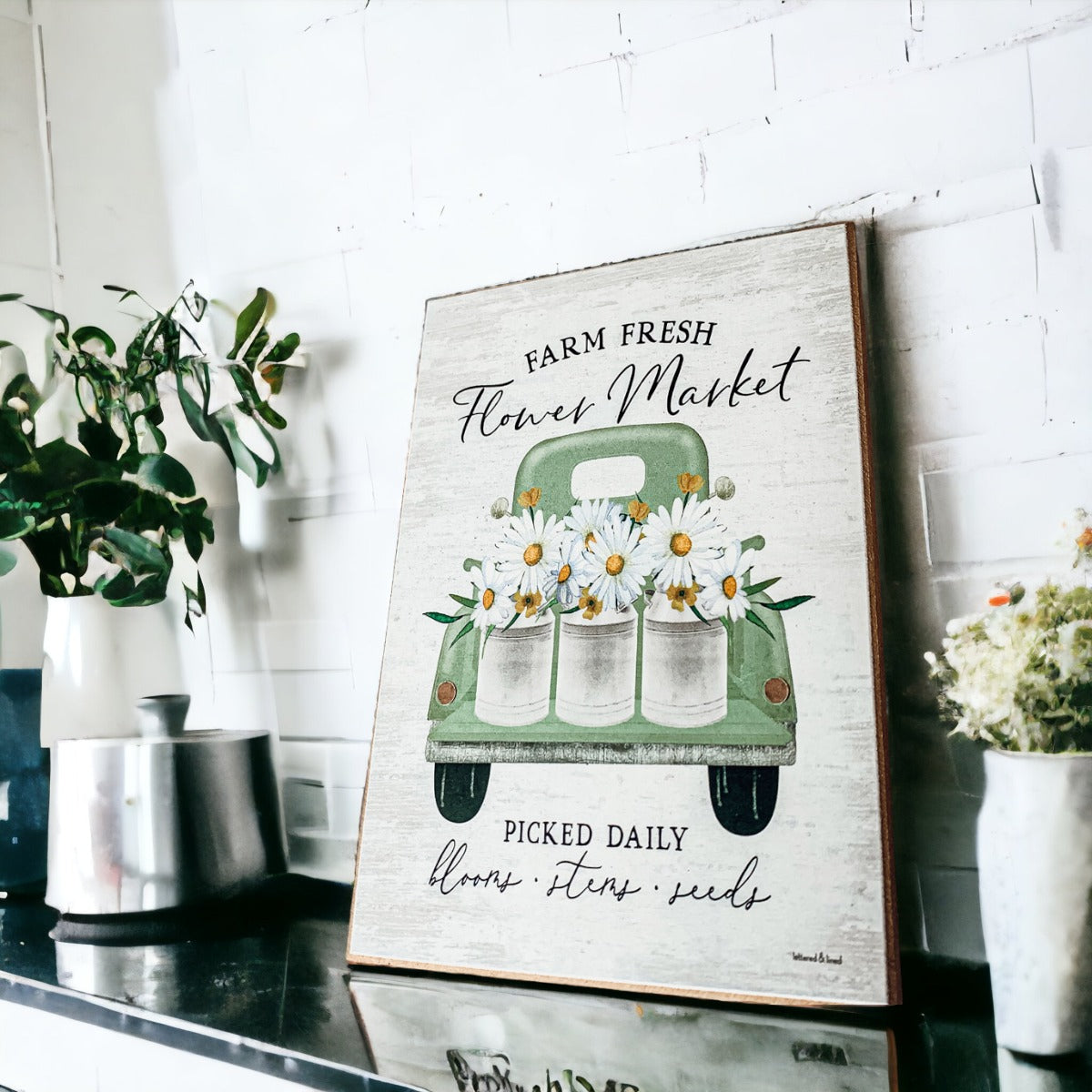 Farm Fresh Flower Market sign featuring a vintage green pickup truck filled with flowers, set against a rustic white washed background.