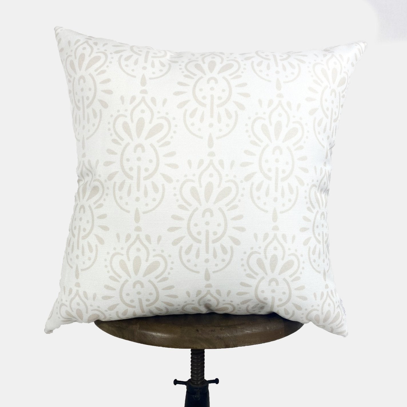 Decorative pillows with vibrant flower and sunburst patterns, showcasing a colorful design perfect for home decor.