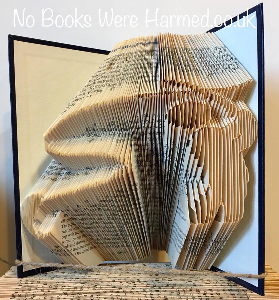 Handcrafted Fly Fisher art made from vintage books, showcasing unique folded pages in a fishing theme.