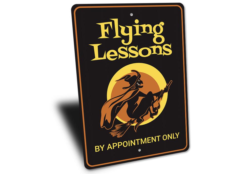 Flying Lessons Witch Sign featuring spooky Halloween design, made from high-quality aluminum with pre-drilled holes for easy mounting.