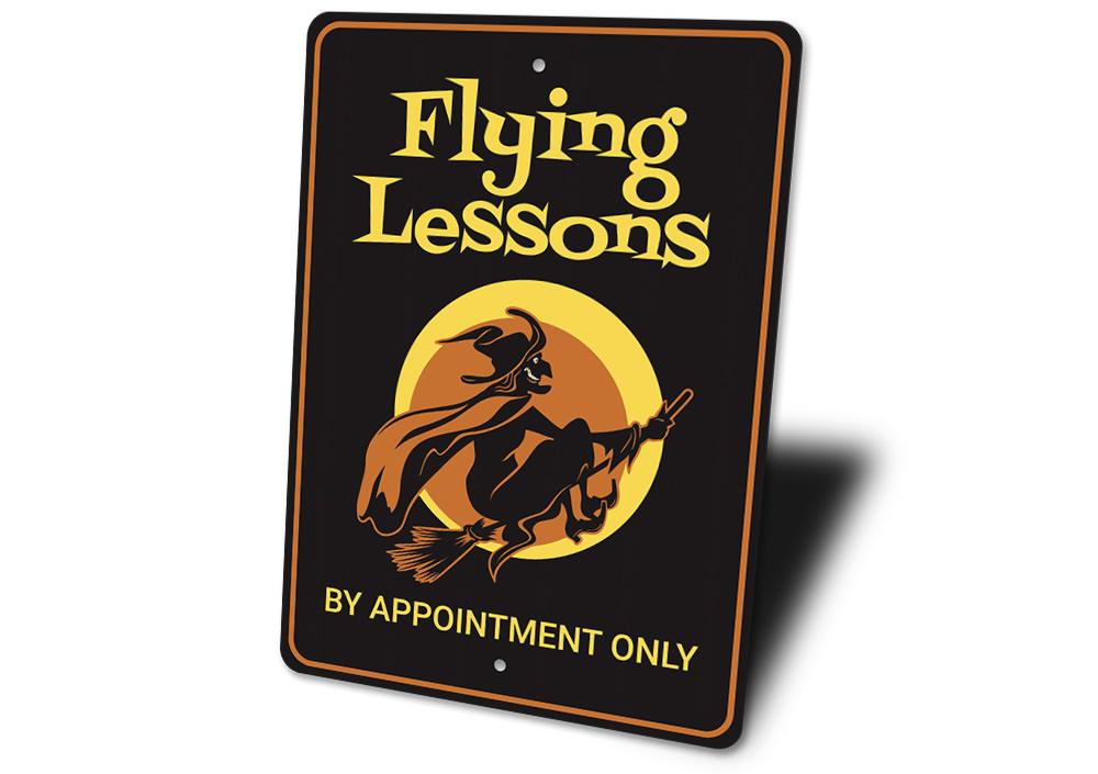 Flying Lessons Witch Sign featuring spooky Halloween design, made from high-quality aluminum with pre-drilled holes for easy mounting.