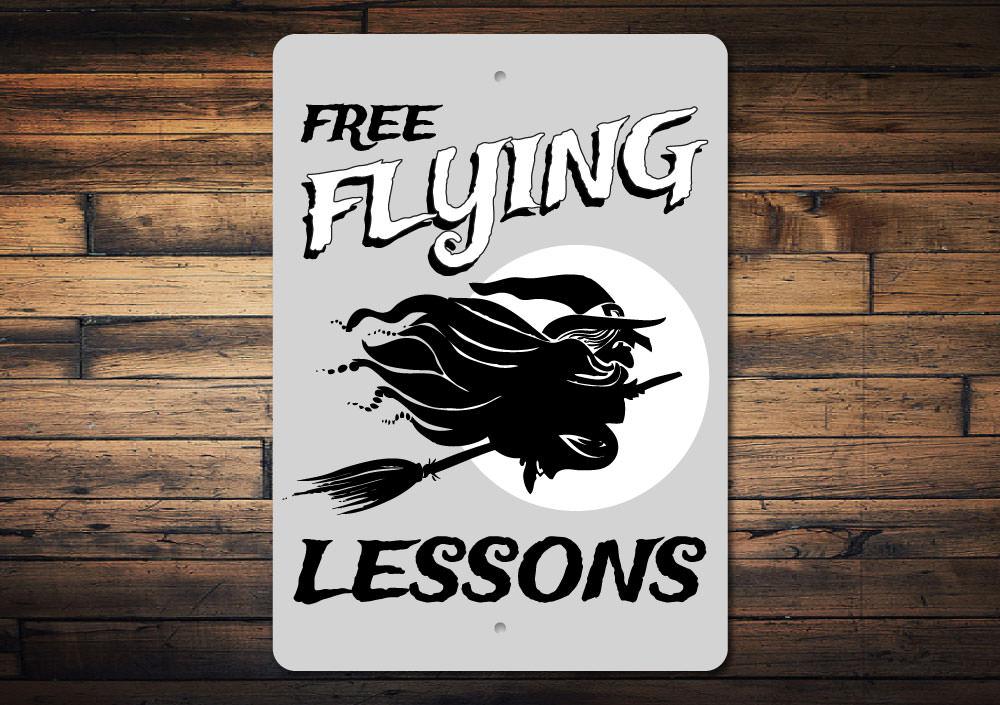 A decorative Flying Witch Sign featuring a spooky design, perfect for Halloween decorations, made from durable aluminum.