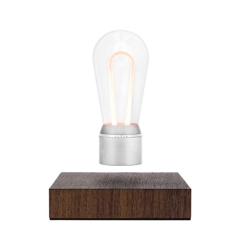 FLYTE Nikola levitating light bulb with Walnut base and Chrome Marconi bulb, showcasing innovative design and energy efficiency.