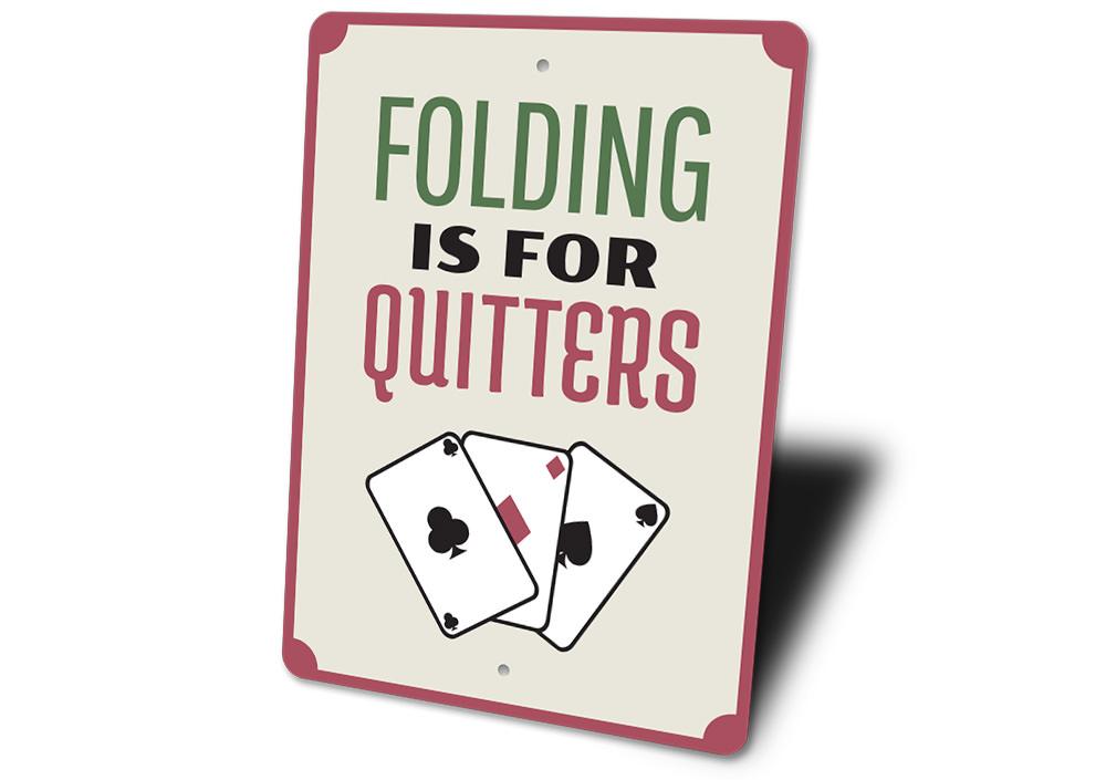 Folding is for Quitters Sign made of aluminum, featuring humorous text, perfect for home decor.