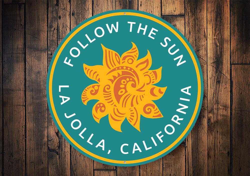 Custom Follow the Sun Sign made of aluminum, featuring vibrant colors and beach-themed design, perfect for coastal decor.