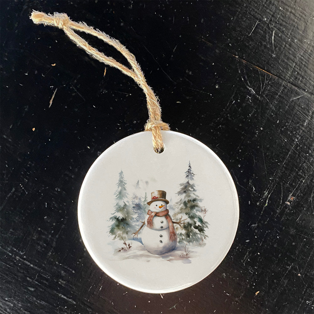 A charming porcelain ornament featuring a Forest Snowman design, perfect for holiday decor and gift giving.