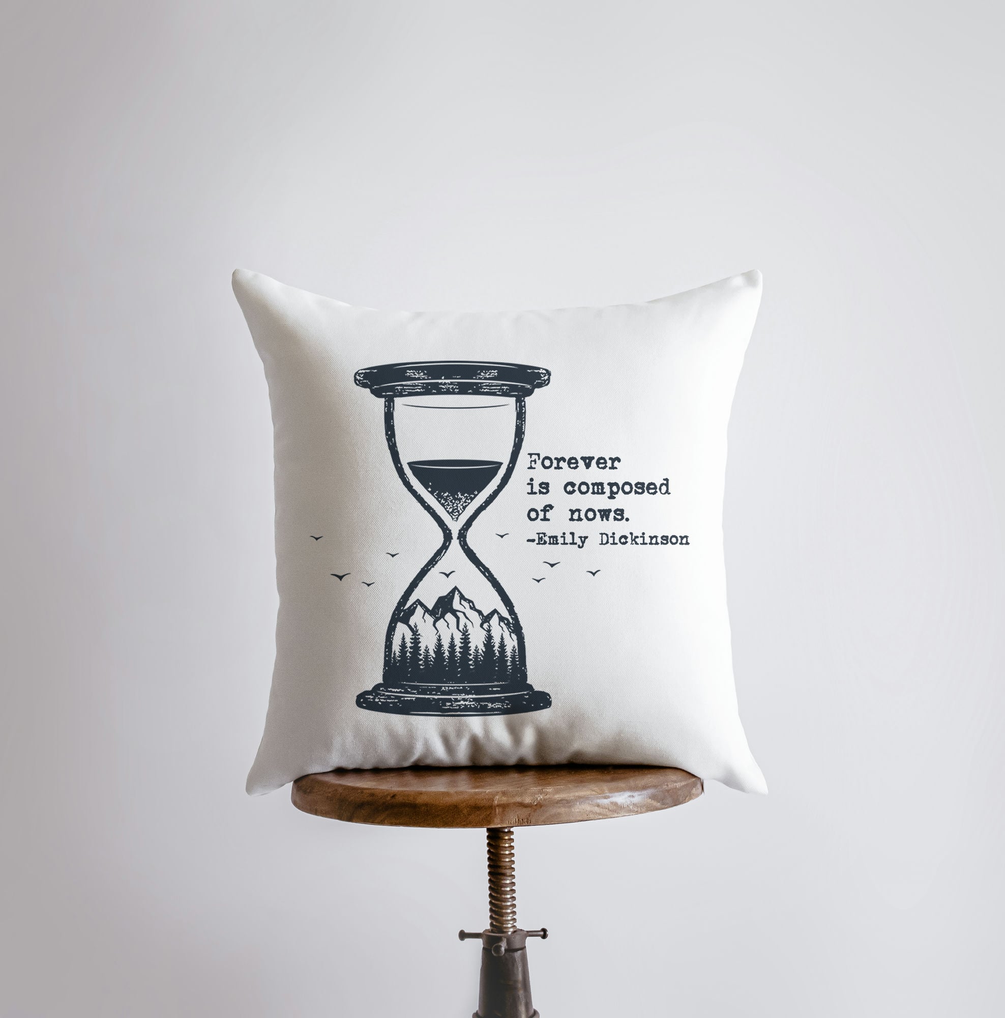 Handmade pillow cover featuring Emily Dickinson's quote 'Forever is composed of nows' with an hourglass and mountain scene design.