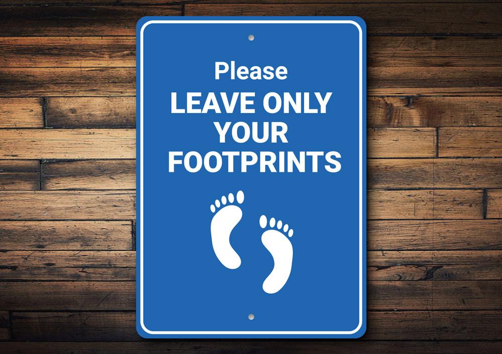 Footprints Only Sign made of high-quality aluminum, featuring customizable text and pre-drilled holes for easy mounting.