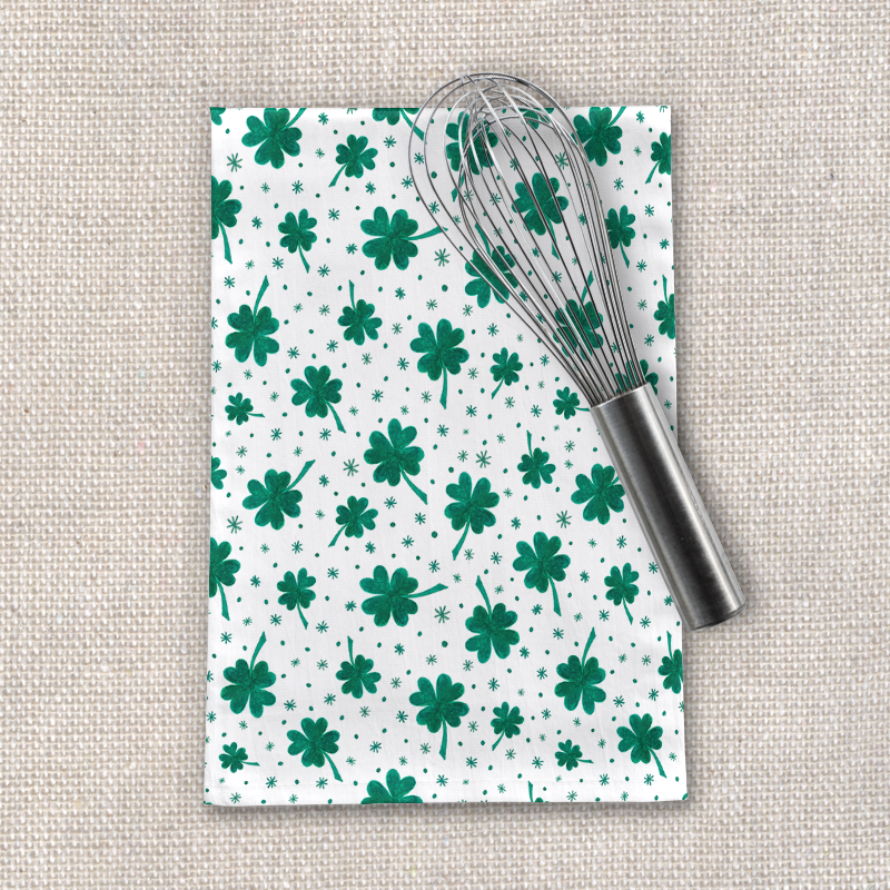 Four Leaf Clover tea towel featuring a vibrant green clover design on a white cotton twill fabric, perfect for St. Patrick's Day.