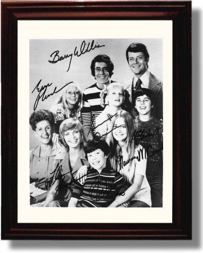 Framed glossy print of the Brady Bunch cast with a printed signature, perfect for fans and collectors.