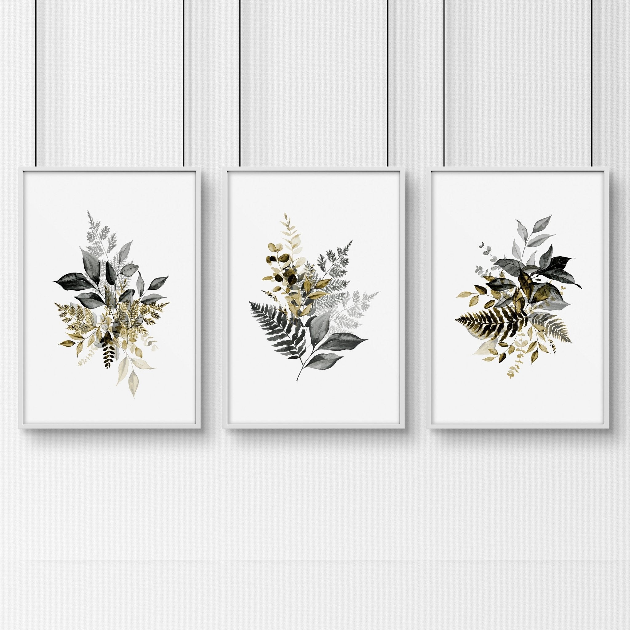 Set of 3 framed watercolor botanical prints showcasing intricate nature illustrations in soft colors, perfect for living room decor.