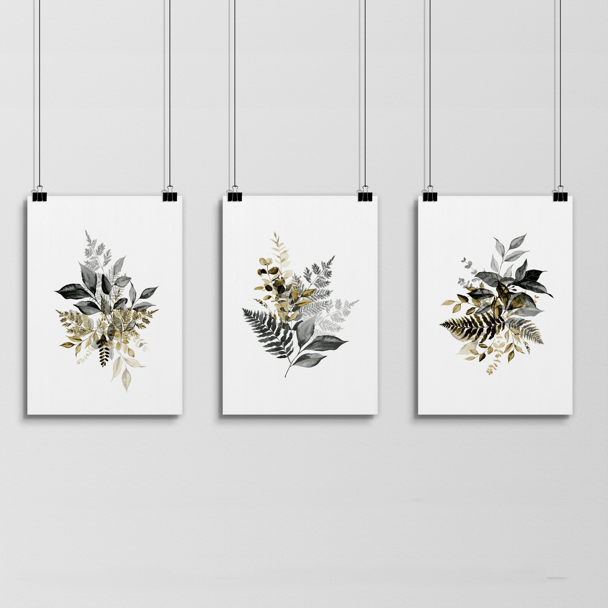 Set of 3 framed watercolor botanical prints showcasing intricate nature illustrations in soft colors, perfect for living room decor.