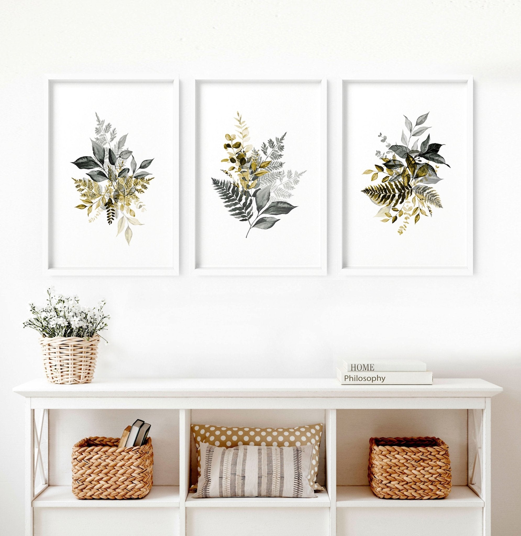 Set of 3 framed watercolor botanical prints showcasing intricate nature illustrations in soft colors, perfect for living room decor.