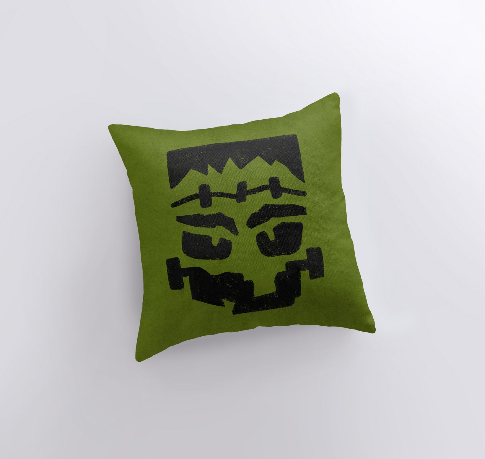 Frankenstein's Monster Pillow Cover featuring a spooky design, perfect for Halloween and fall décor, with a solid white back and concealed zipper.