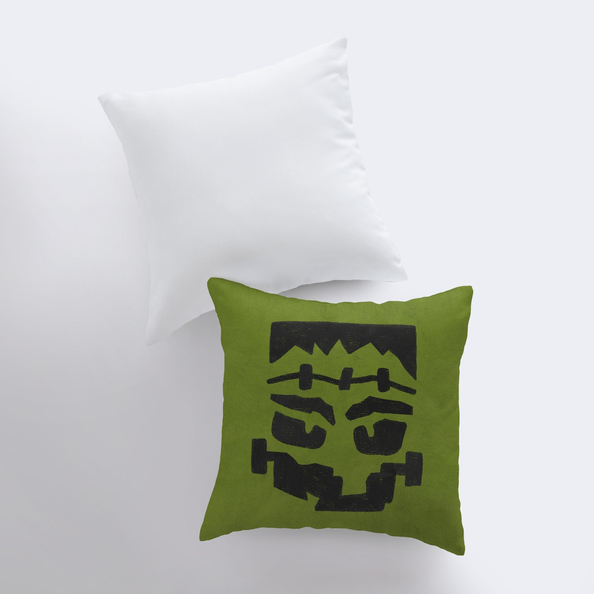 Frankenstein's Monster Pillow Cover featuring a spooky design, perfect for Halloween and fall décor, with a solid white back and concealed zipper.