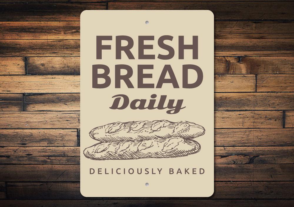 A decorative Fresh Bread Sign made of high-quality aluminum, featuring a rustic design suitable for bakeries and cafes.