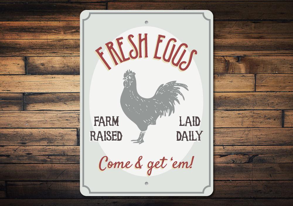 Fresh Farm Raised Eggs Sign made of durable aluminum, featuring a rustic design perfect for home decor.