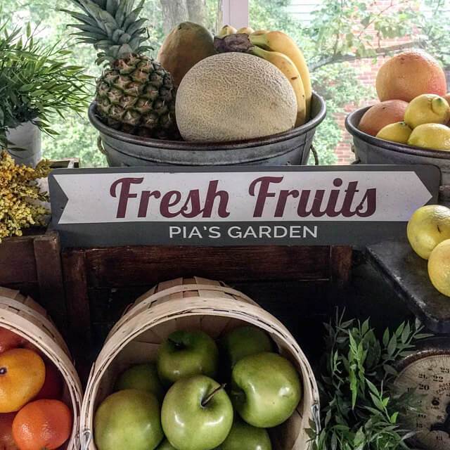 A vibrant Fresh Fruits Sign made of high-quality aluminum, featuring colorful fruit designs, perfect for kitchen or dining room decor.