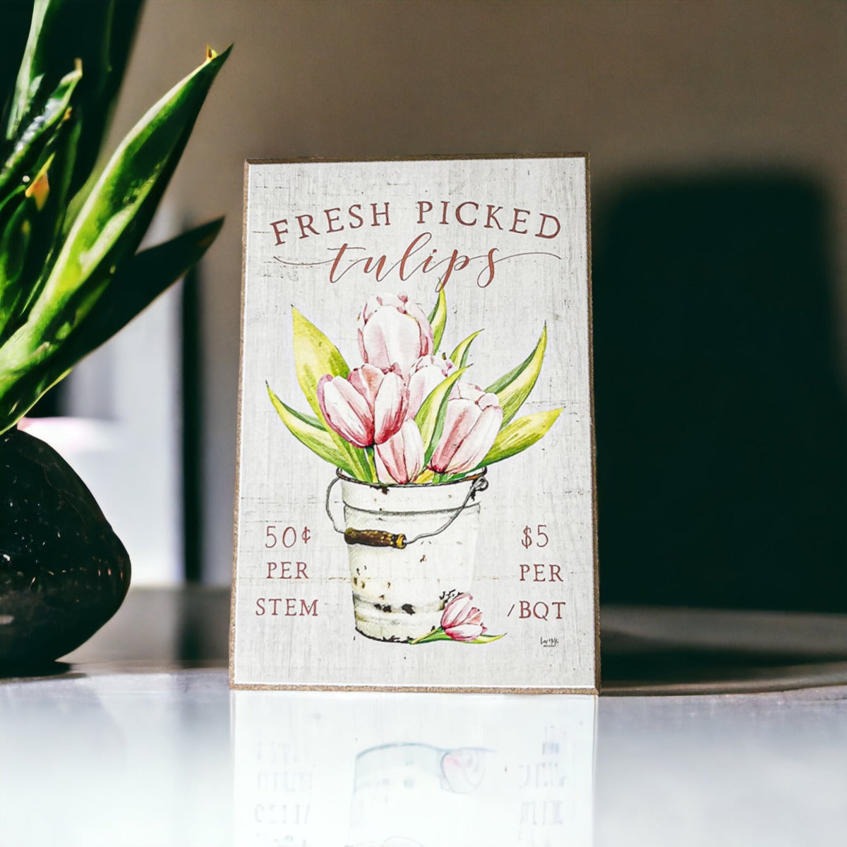 A charming wooden block sign featuring fresh tulips, perfect for spring and summer home decor.