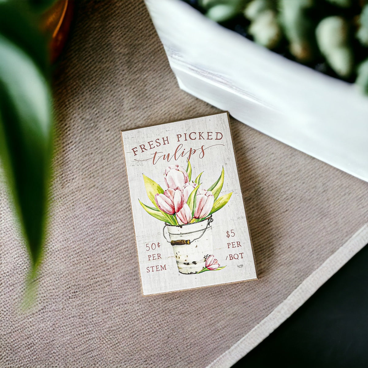 A charming wooden block sign featuring fresh tulips, perfect for spring and summer home decor.