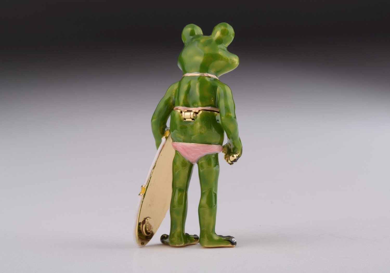 A beautifully crafted Frog Holding a Surfboard trinket box, adorned with Austrian crystals and plated with 24K gold, showcasing intricate details.