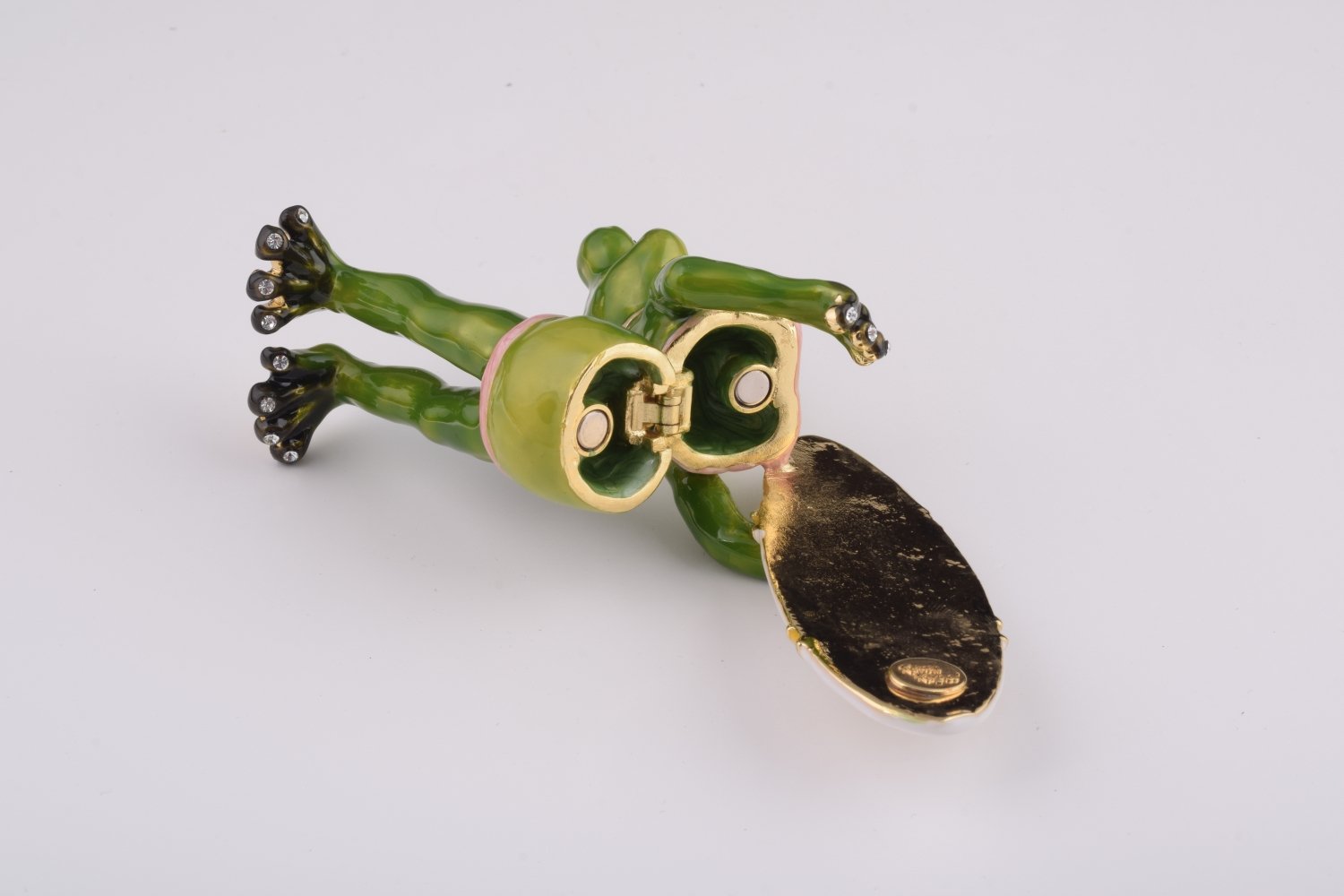 A beautifully crafted Frog Holding a Surfboard trinket box, adorned with Austrian crystals and plated with 24K gold, showcasing intricate details.